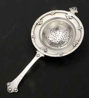 Frank M Whiting antique sterling tea strainer with applied strapwiork
